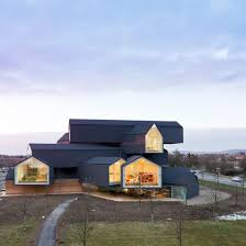 The theme of the archetypal house and the theme of stacked volumes. Vitrahaus Flagship Store Connox Shop