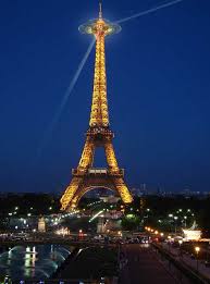 The eiffel tower is an iron tower built on the champ de mars beside the river seine in paris. Eiffel Tower History Paris France E Architect