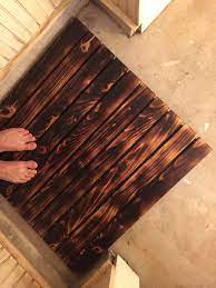 make a burnt wood bath mat