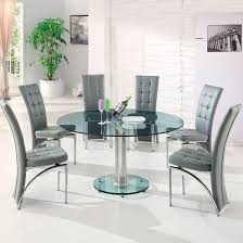 A handsome dining room set with round table and six chairs. Maxi Round Dining Set In Clear Glass And 6 Ravenna Grey Chairs 629 95 Go Furniture Co Uk