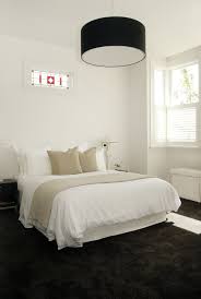 bedroom with white walls and dark c