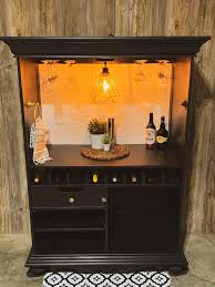 The cabinet offers racking space for wine bottles and storage for a host of liquor bottles on shelves and doors. Sold Modern Farmhouse Wine Bar Liquor Bar Beverage Bar Etsy In 2021 Farmhouse Wine Bar Modern Glass Liquor Cabinet Bar