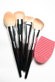 set of used makeup brushes with metal