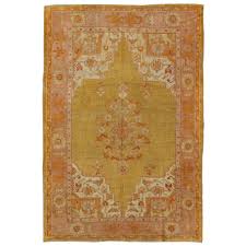 antique oushak rug in yellow green