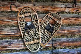 Snow Shoes On An Old Cabin Wall