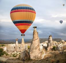 It is a landscape like no other in the world. Hot Air Balloon Flying Over Cappadocia Turkey Fire Sunset Stock Photo 238723362
