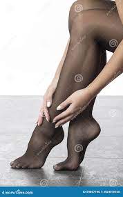 Woman Stroking Leg with Black Stockings or Tights Stock Photo - Image of  feet, legs: 54867740