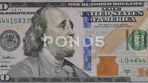 ben franklin winks at us from the 100