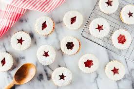 Crescent shaped christmas cookies called 'vanillekipferl', a traditional austrian or german christmas biscuits with nuts and icing sugar surrounded by christmas decoration. German Christmas Recipes And Traditions