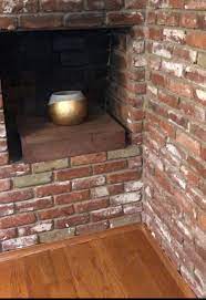 brick fireplace and wooden beams