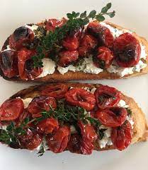 Place a slice of bruschetta on the side and place the goats' cheese on top. Recipes Roasted Cherry Tomato And Goat Cheese Bruschetta