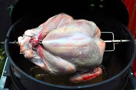 rotisserie grilling the big turkey