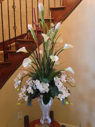 If you are craving to bathe in them. Calla Lily With Orchid Flower Arrangement For Perfect Foyer Or Staircase By Ar Large Flower Arrangements Church Flower Arrangements Orchid Flower Arrangements