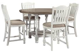 The set is fully constructed from wood but the these pieces of furniture provide classic and interesting style to these types of interiors. Havalance Counter Height Dining Table And 4 Barstools Set Ashley Furniture Homestore