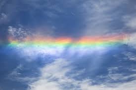 rainbow colored clouds in the sky