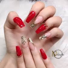 Build your nails with acrylic gel and choose two nail polishes, in red and golden colors. Coffin Red And Gold Acrylic Nails Nail And Manicure Trends