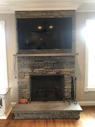 75 Tv Mounted Above Stone Fireplace