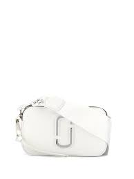 Marc jacobs isn't usually one to take an understated route, but this snapshot crossbody foregoes embellishments and colour for a subdued monochromatic design. Shop White Marc Jacobs The Snapshot Camera Bag With Express Delivery Farfetch