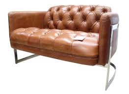 The lighter shade of a tan leather sofa, compared to darker brown alternatives, is also a great match for colder colour palettes, such as grey and teal. Metal Frame Chesterfield Buttoned 2 Seater Distressed Tan Leather Sofa