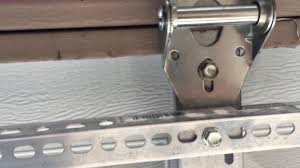 buckling popping garage door panel