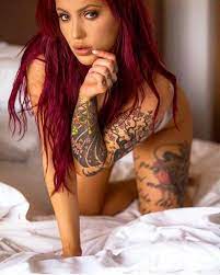 Sexy tattooed redhead