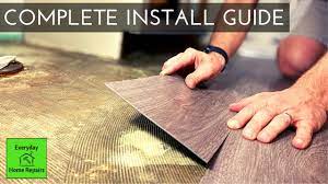 This adhesive secures the glue down vinyl floors to their base. How To Install Glue Down Vinyl Plank Flooring Bathroom Concrete Floor Youtube