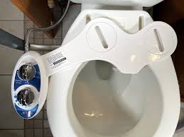 a bidet with a raised toilet seat