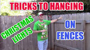 how to hang christmas lights on a fence