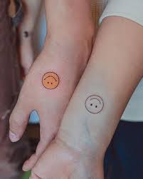 20 cheerful happy face tattoo designs