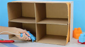 a dollhouse from a cardboard box