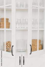 Opened White Glass Cabinet With Clean