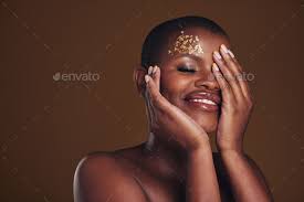 beauty and black woman with gold makeup