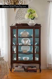 This curio cabinet is a gorgeous display piece for your living room featuring four glass doors, and six glass shelves, with embedded can lighting, this unit provides display, storage and style, with versatile placement options throughout your home. Creative Uses For China Cabinets Orphans With Makeup