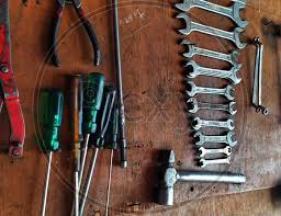 Repairing Tools Hanging On Wooden Board