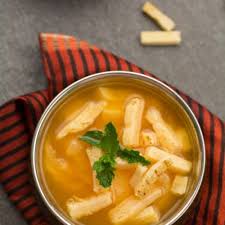 clear tomato soup with herbs pepper bowl