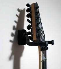 hanging a guitar on the wall