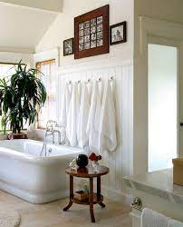 Utilize the space around your tub to sneak more storage into your bathroom. Beautiful Bathroom Towel Display And Arrangement Ideas