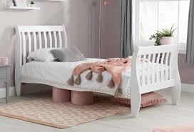 white wooden single bed frame the bed