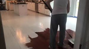 to paint wood floors without sanding