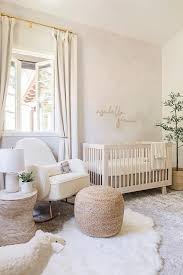 soft pale pink nursery with gray rug