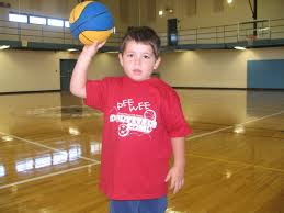 young children to shoot a basketball
