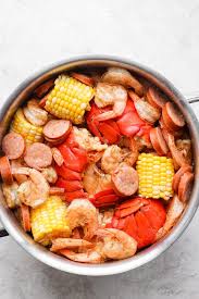 Blue crabs, crab boil, bay leaves, spice mix, canola oil, large shrimp and 11 more easy seafood boil fit foodie finds fresh lemon, large garlic cloves, canned diced tomatoes, lobster tails and 38 more Easy Seafood Boil Recipe One Pot Dinner Fit Foodie Finds