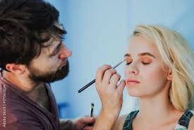professional male makeup artist working