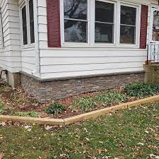 House Foundation With Faux Stone Panels