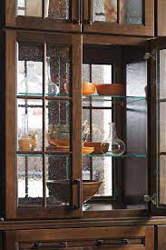 with glass shelves kemper cabinetry