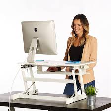 This is a manually adjustable model. Standing Desk The Deskriser Height Adjustable Heavy Duty Sit To Stand Office Desk Supports Up To 50 Lbs 32 Wide Sit Stand Up Desk Converter