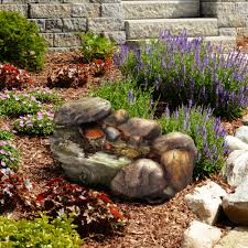 outdoor water fountain with stone