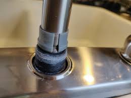 kitchen faucet leaking at base of spout
