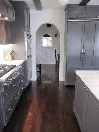 If you really like the practicalities of tiled flooring, but really love the aesthetic of a hardwood floor, then wood look ceramic tile or wood look lvt tile might just be the perfect kitchen floor tile idea for you! Image Result For Kitchen With Rustic Slate Floors Grey Cabinets Marble Counters White Cabinets Kitchen Dark Floors Dark Grey Kitchen Cabinets Dark Grey Kitchen