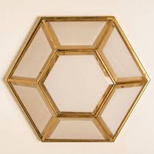 white hexagonal glass brass wall lights